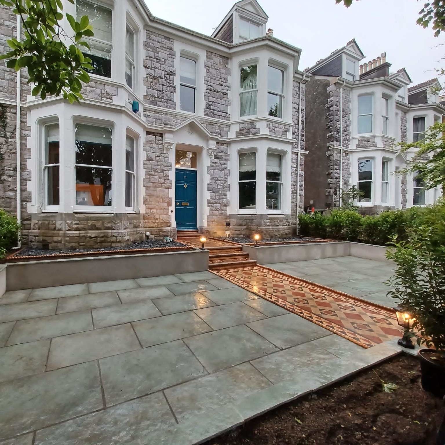 Landscaping in Plymouth. Paved Victorian front garden with new raised beds and patterned pathway.