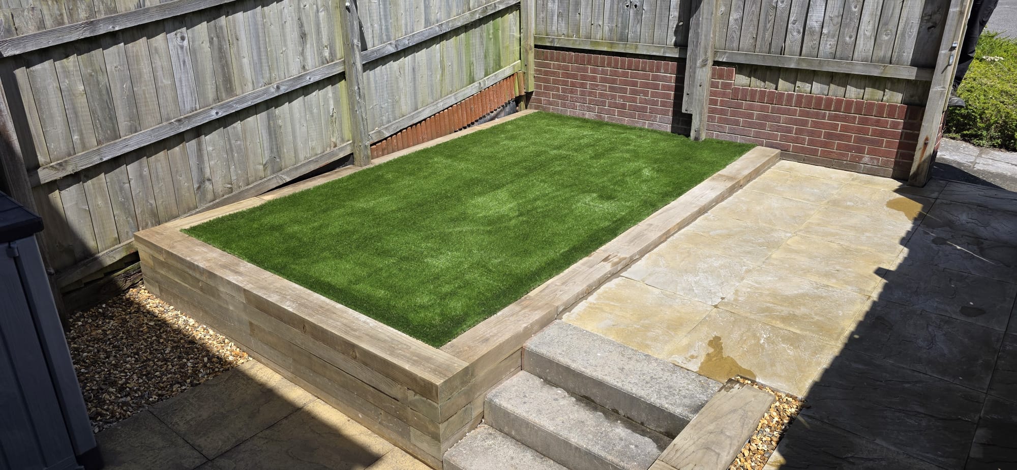 artificial turf and paved slabs with steps